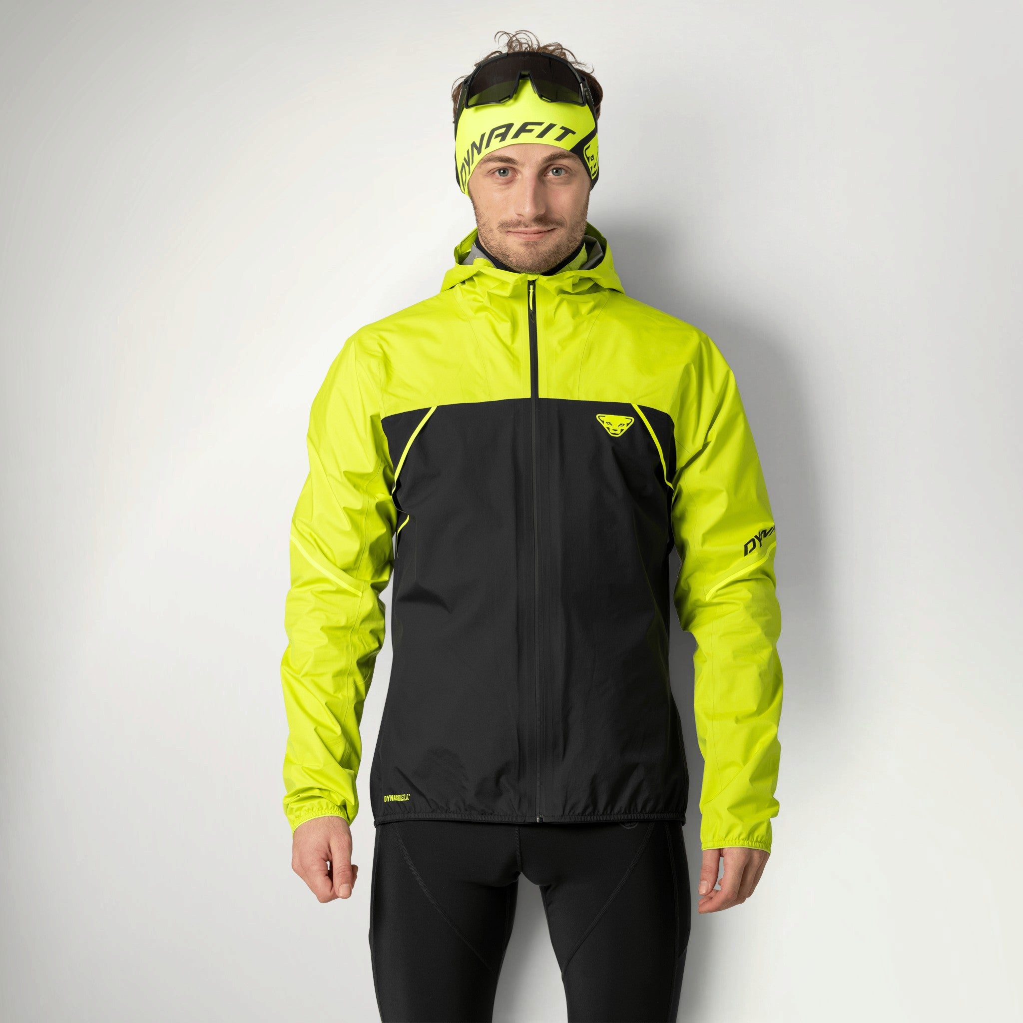 Dynafit Alpine 3-Layer Jacket Men's in Ultra Yellow worn by a runner, front view