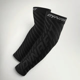 Pair of Dynafit Performance Arm Guards in black with tonal diagonal Dynafit logo print and grey branded cuffs