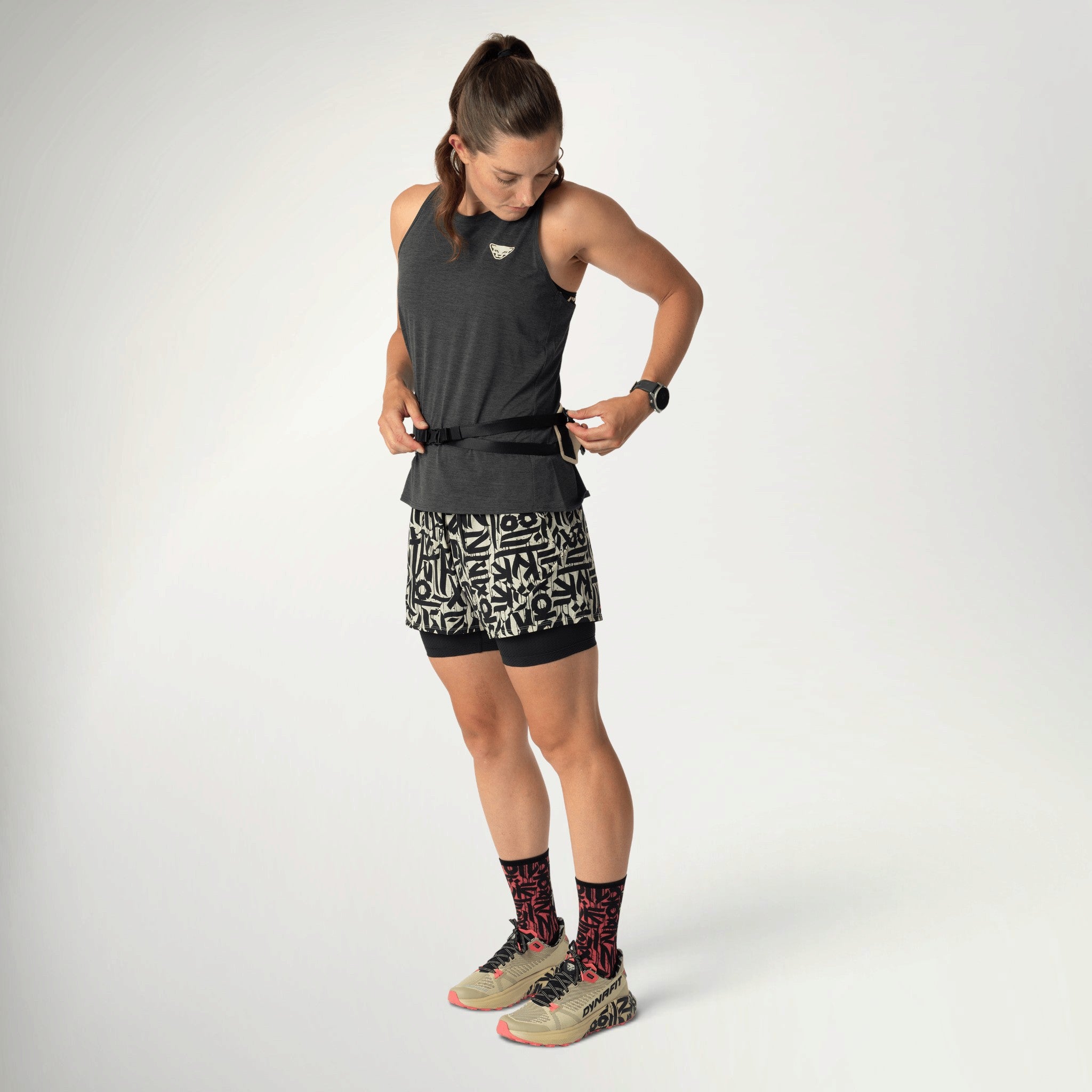 Dynafit Trail Belt in Overcast worn by a runner, front view with the belt at the waist