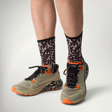 Dynafit Trail Graphic Running Shoe Men's worn with patterned socks, front view