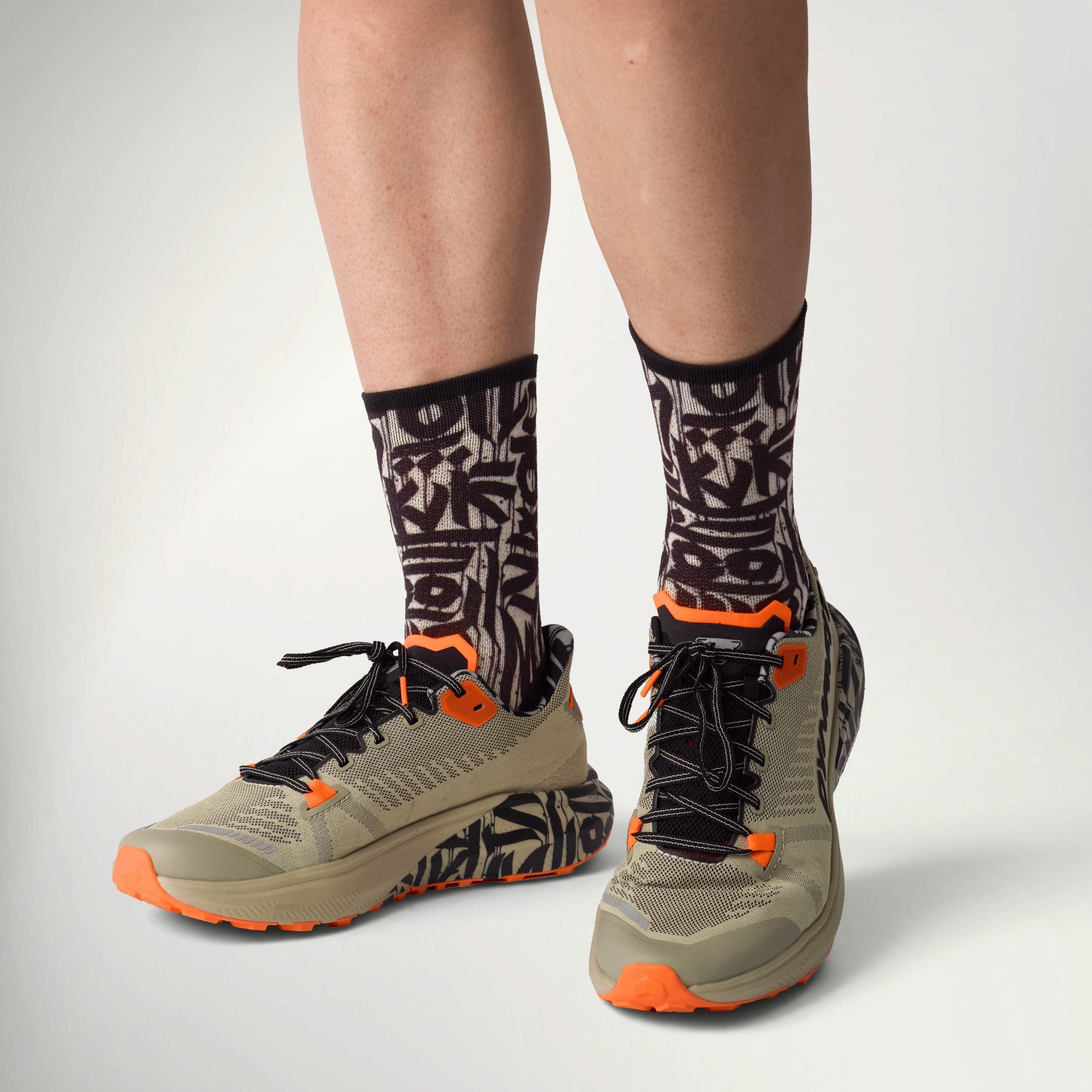 Dynafit Trail Graphic Running Shoe Men's worn with patterned socks, front view