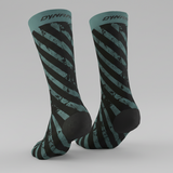 Pair of Dynafit Trail crew running socks in Atlantic, teal and black diagonal stripes with Dynafit logo on the cuff
