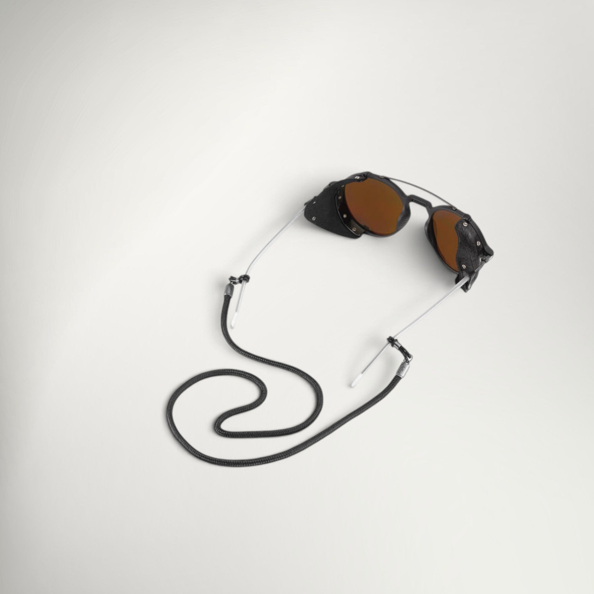 Julbo Cord 3.5mm in Black attached to a pair of glasses