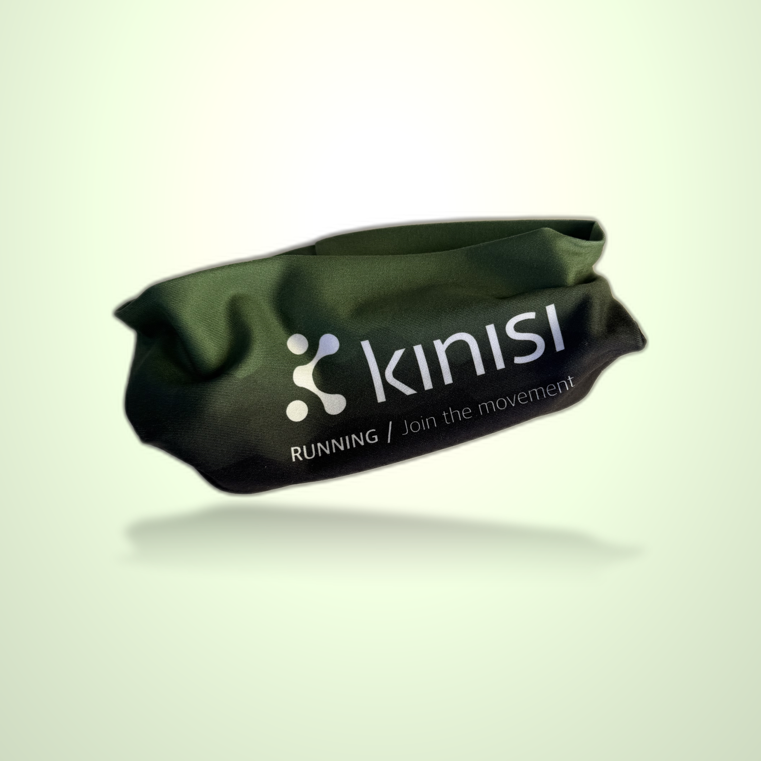 A dark olive green fabric headband with white printed branding for 'kinisi RUNNING / Join the Movement', shown floating against a pale green gradient background.
