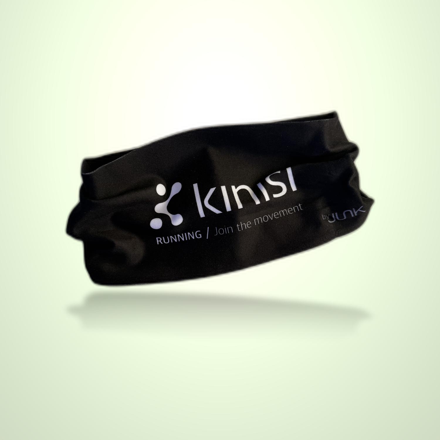 A black athletic headband with Kinisi Running / Join the Movement logo on it floating on a light green background.