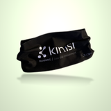 A black athletic headband with Kinisi Running / Join the Movement logo on it floating on a light green background.