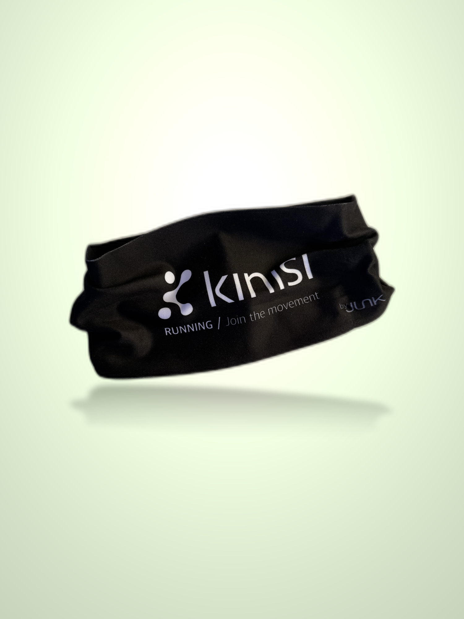 A black athletic headband with Kinisi Running / Join the Movement logo on it floating on a light green background.