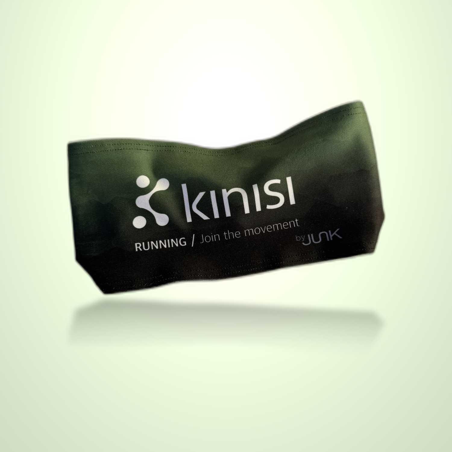 A dark olive green running headband with white printed Kinisi Running logo and text, shown floating against a light green gradient background.