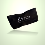 A black Kinisi running headband with white printed logo and text, shown floating against a light green gradient background.