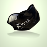 A black athletic headband with white printed Kinisi Running branding and text, shown floating against a pale green gradient background with a soft reflection underneath.