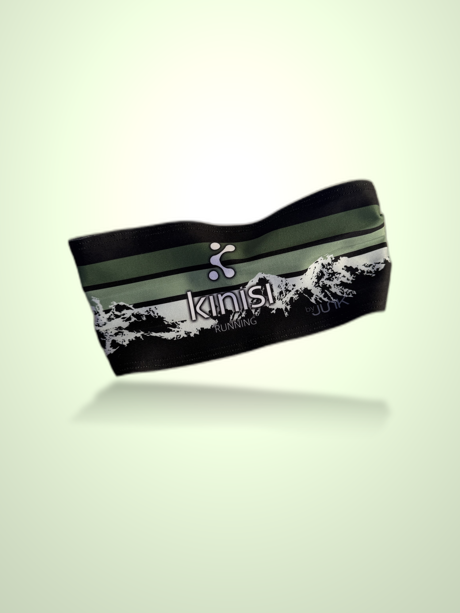 A black athletic headband with green stripes and a white mountain graphic, featuring the 'kinisi running' logo, shown floating against a pale green gradient background.