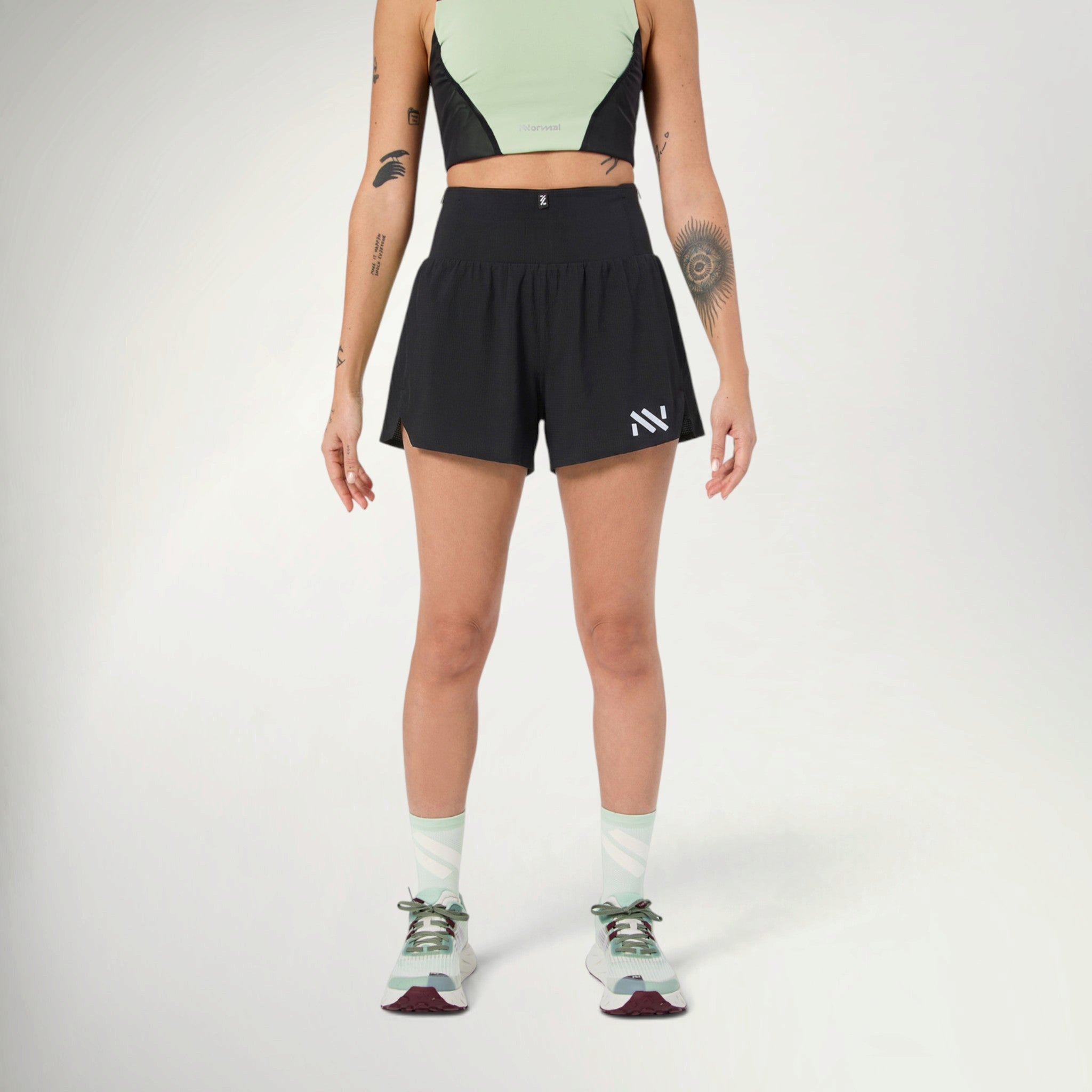 NNormal Race Shorts Women's in Black worn by a runner, front view