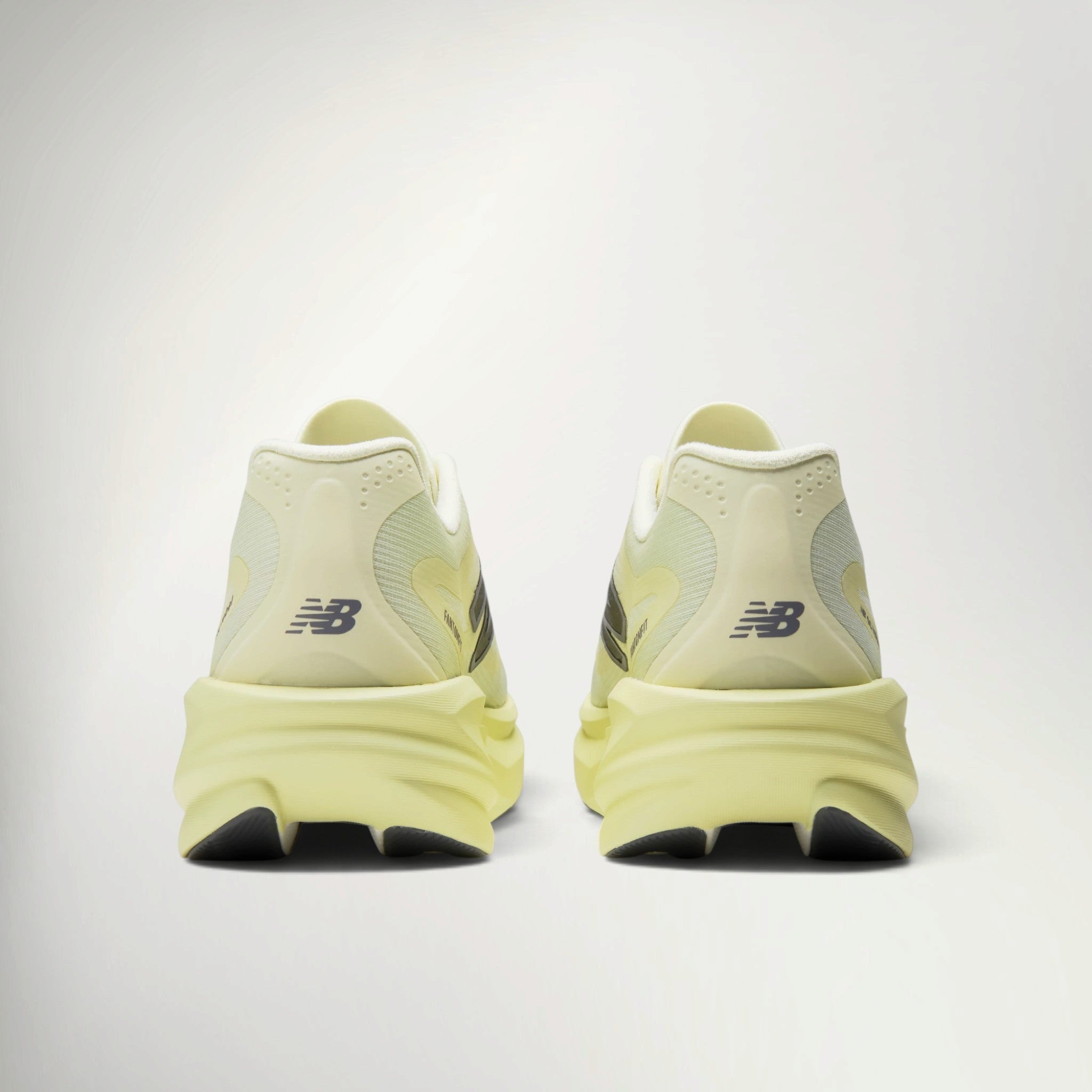 New Balance SuperComp Rebel Men's in Pistachio Butter, heel view of the pair