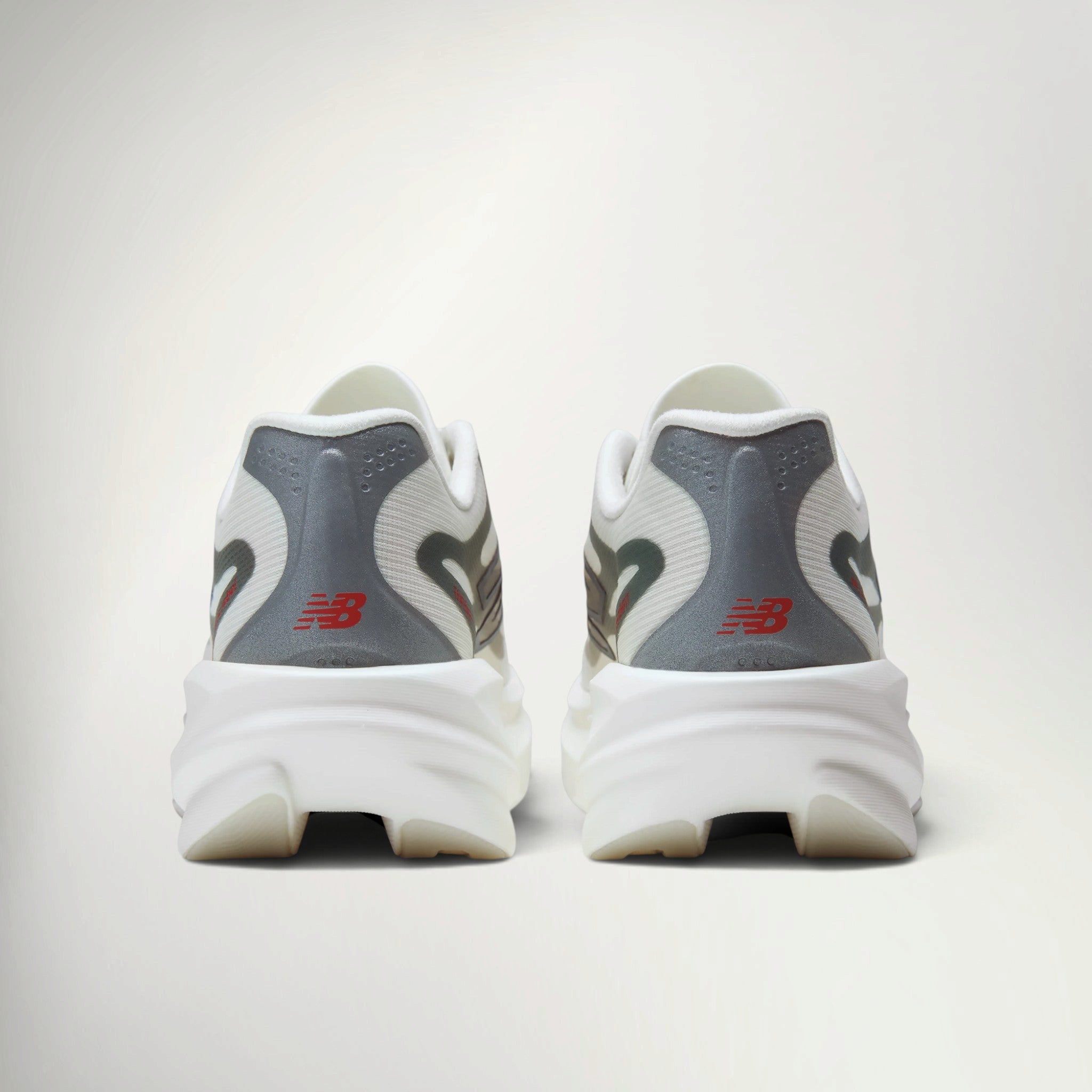 New Balance SuperComp Rebel Women's in Sea Salt, heel view of the pair