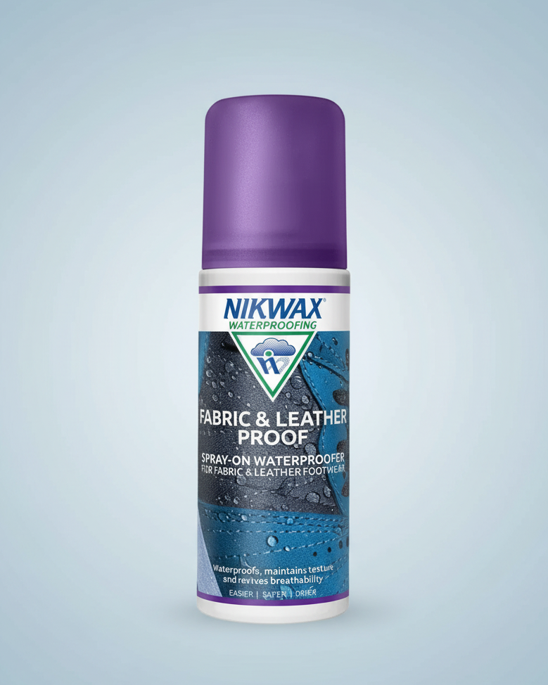 A bottle of Nikwax Waterproofing Fabric & Leather Proof spray-on waterproofer, featuring a purple cap and a blue and white label, set against a plain white background.
