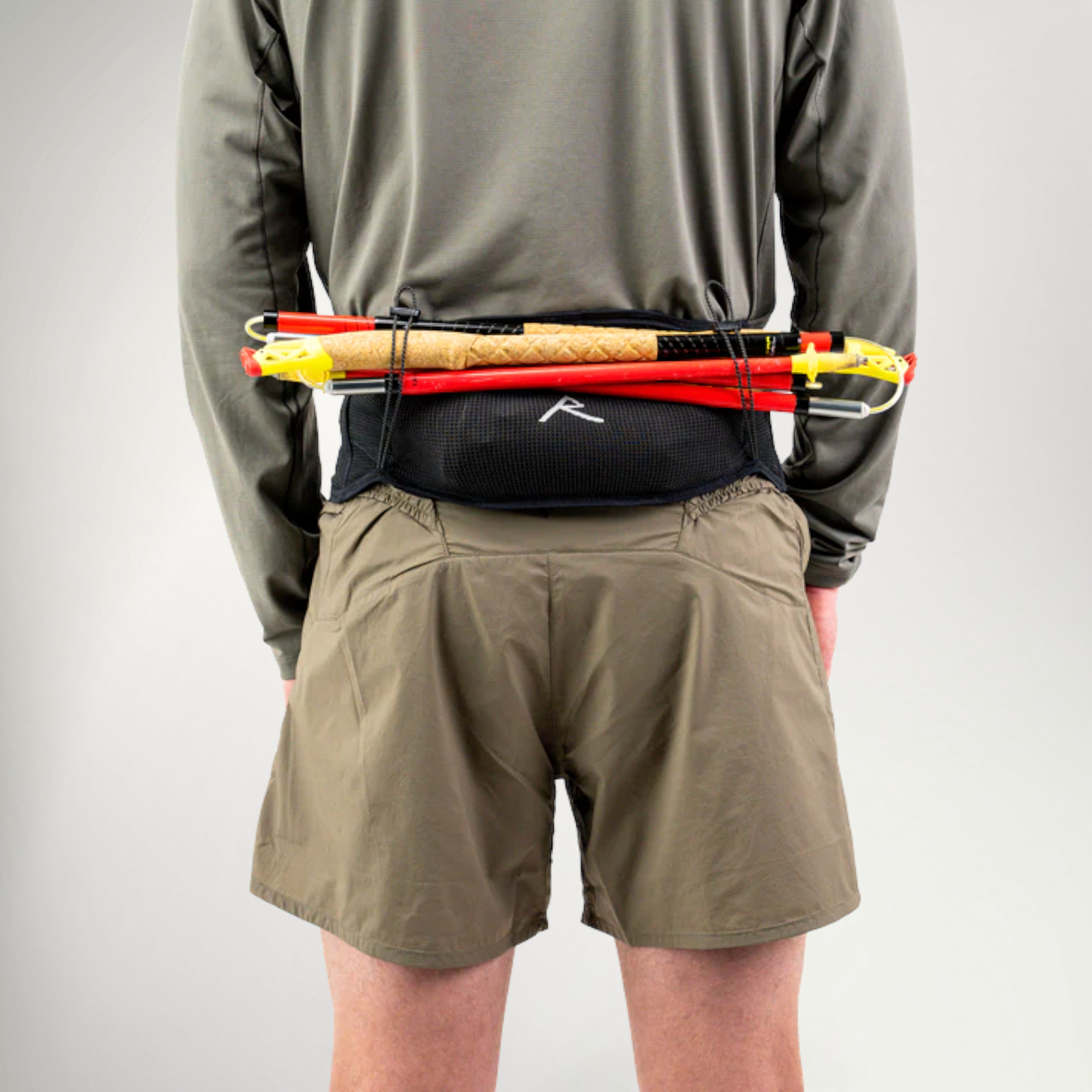 Runner wearing the Raide LF 2L Running Belt loaded with soft flasks