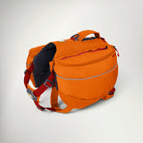 Ruffwear Approach Pack dog backpack in Campfire Orange, with saddlebag pockets, padded harness and red straps