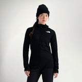 Woman wearing The North Face Women's Summit Series FUTUREFLEECE Full Zip in Black, front view with black beanie