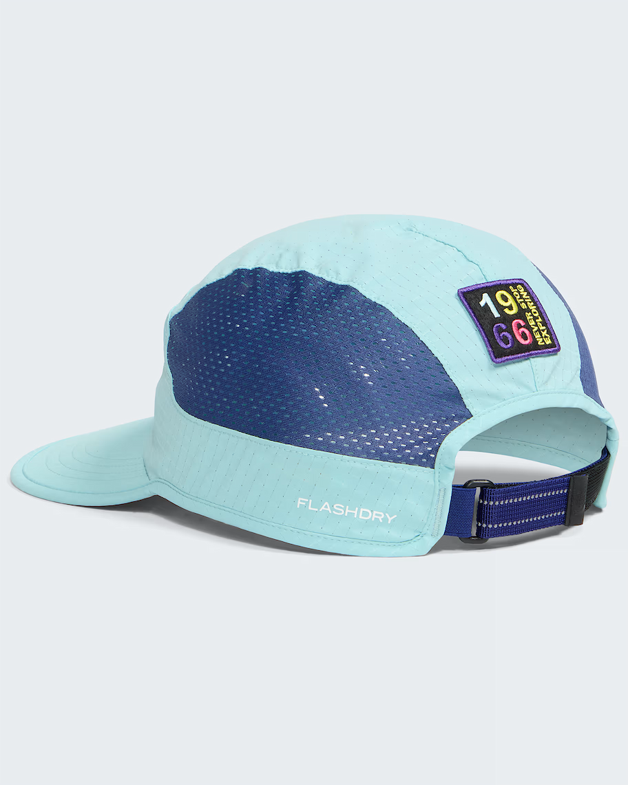 A light blue and navy blue 5-panel running cap with a mesh back panel, a small '1966 FlashDry' patch on the side, and 'FLASHDRY' printed on the brim, shown on a light gray background.