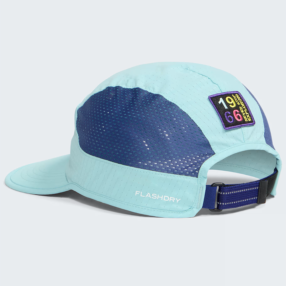 A light blue and navy blue 5-panel running cap with a mesh back panel, a small '1966 FlashDry' patch on the side, and 'FLASHDRY' printed on the brim, shown on a light gray background.