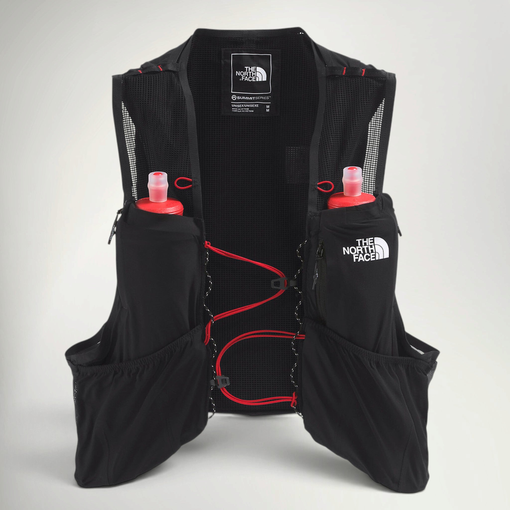 The North Face Summit Series Run Vest 10 in Black, front view with two red-capped soft flasks and red bungee sternum straps