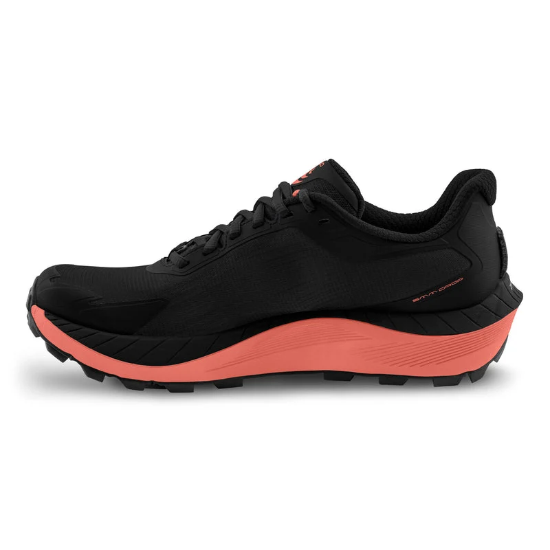Black and red athletic shoe on a white background