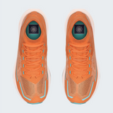 A pair of TNF orange athletic sneakers shown from a top-down view on a light gray background. The shoes feature a textured knit upper, matching orange laces, and light blue accents along the sides and around the eyelets.