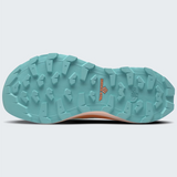 The rugged outsole of TNF trail running shoes in a light teal blue-green color, featuring deep lugs and a small orange 'Surface CTRL' logo, shown against a light gray background.