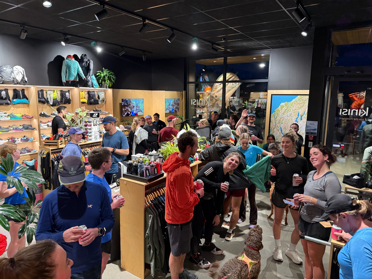The Thursday Run 4 Fun crew catching up over drinks inside the Kinisi Running shop in Wānaka after the run